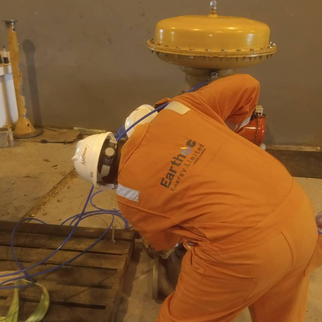 Earthoc trainees working with industrial equipment