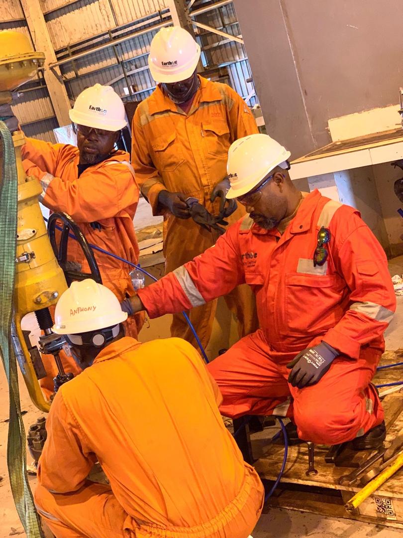 Earthoc trainees working with industrial equipment
